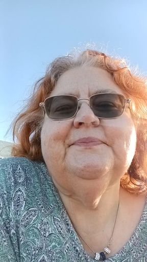 Bearded Lady try's to  lights  on windy beach!