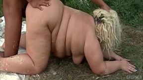 Blonde bombshell with massive tits gets wild with outdoor pussy play