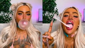 Big lips blowing popping bubblegum bubbles long nails