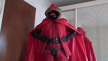 bella in red rubberlined suit