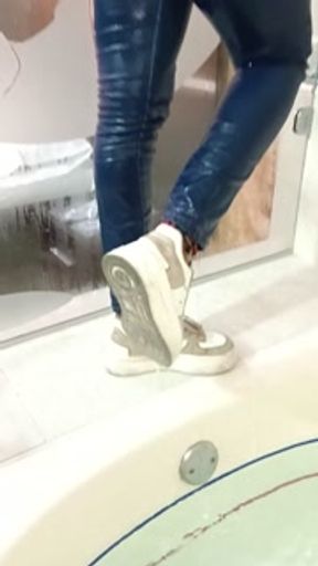 Girlfriend wetlook in jeans and sneakers