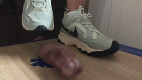 Grey Nike trampling sneakers job
