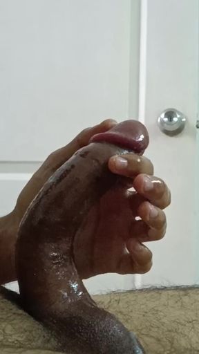 hot boy using oil to stroke his full length cock and ball big and cum hard