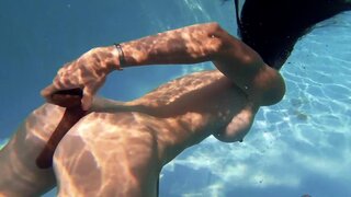 Sofie Marie shoves a big black dildo up her ass near the pool