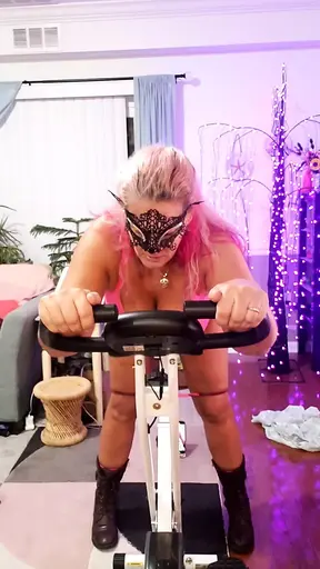 Sexy blonde fucks and sucks on exercise bike