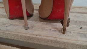 Kat Sinks Her Sharp Louboutins into a Wooden Pallet