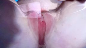 Autumn Orchid moans while grinding her used up pussy against her clear chair, then rubs her clit while peeing