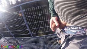 I'm working on my foreskin cock outside on a very public observation tower by a river.