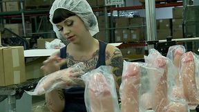 Kinky tattooed brunette worker masturbates in the dildo factory