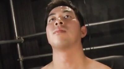 Blindfolded Asian bloke gets his pecker stroked by a stranger