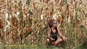 Pee in a corn field - Crossing her legs to calm her full bladder and wet her jeans in the heat outdoor