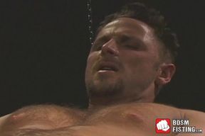 Kinky gay tugs on his cock while being fist fucked hardcore