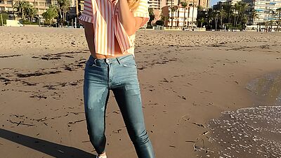 Wet shoot on a public beach with Crazy Model. Risky outdoor masturbation. Foot fetish. Pee in jeans.
