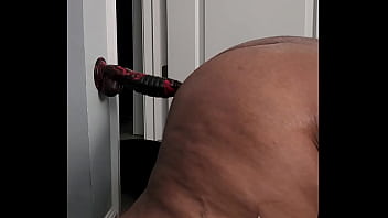 Chubby tranny plows dildo on wall