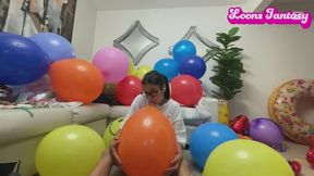 Akina blows up balloons in the floor