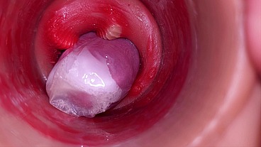 The camera inside the deep pussy records a huge ejaculation with a stuck condom