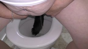 Trashy Kiwi MILF retrieves and reinserts Butt Plug tail after it falls out while pissing in toilet