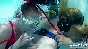 Two hot girls blow big cock in the pool with Minnie Manga