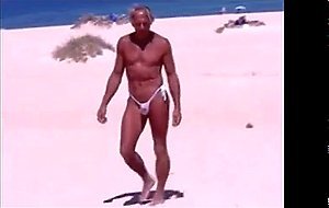 Tanned guy on beach in tiny string thong (temporarily!)