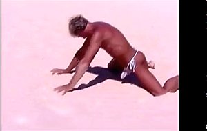 Tanned guy on beach in tiny string thong (temporarily!)