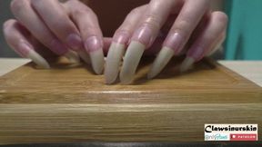 Nails scratching wood