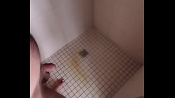 Guy pissing in shower