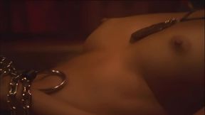 This masked brunette is chained to the bed and awaiting orders