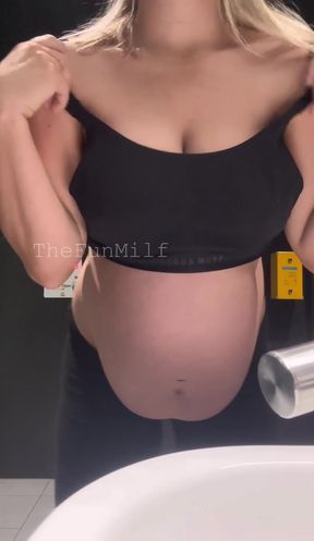 Pregnant milf takes a toilet break