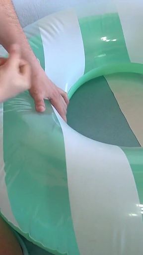 Playing with a Green and White Swimring