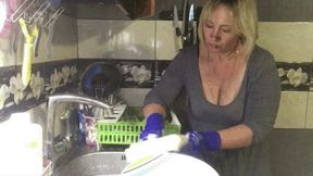 My hands in rubber gloves clean dirty dishes and a clogged sink with plunger wmv