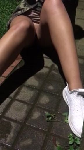 This dirty bitch pees.  on the street after drinking a lot