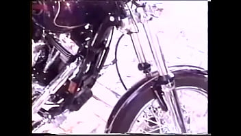 Stunning blonde cutie pie in black outfit is happy to polish with wax wonderful bike before riding big pecker of its owner motorhead
