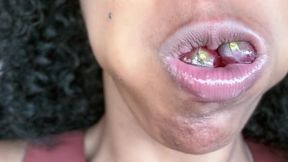 Overstuffing mouth with grapes mouth stuffing grapes