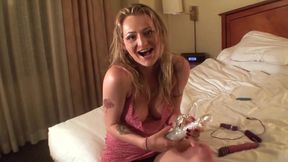 Blonde and ebony share toys in a hotel room