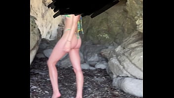 Spanish slut in thong bikini posing at beach