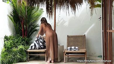 Seductive cleaning by a naked brunette with a BIG ASS in a transparent robe