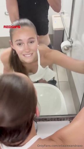 Woman in bathroom mirror