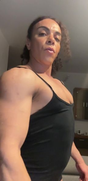 Female bodybuilder in black tank top