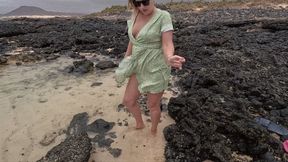 Desperate girl’s pee into the water outdoors