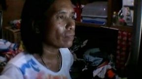 Mature Filipina kneads and licks her flabby boobs in webcam solo