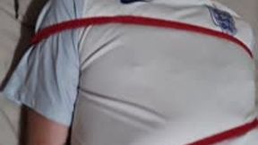 Miss M has a footballer tied to her backboard ready for stockings torment on his cock