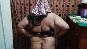 Hijabi girl takes off her clothes and wears a saree. Those big breasts are visible.