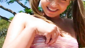 Small teen in pigtails fingers her snatch