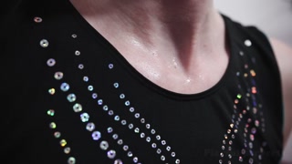 Sweaty abs exercise with feet close up in gymnastics leotard