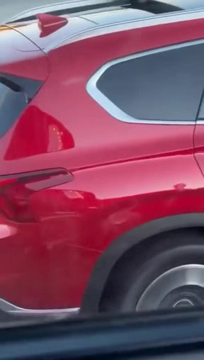 Red car parked on street