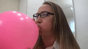 Inflating a large balloon until it explodes c