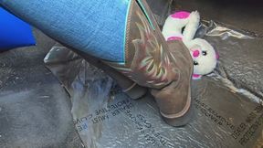 Chrissy playing with her cowgirl boots in car