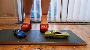 Giantess Lou crushes a Corvette and Chevy Impala in big red chunky heels ground view