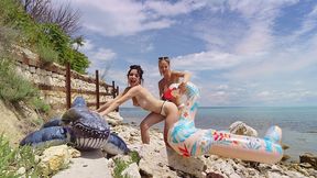 lesbian inflatable domination on the beach