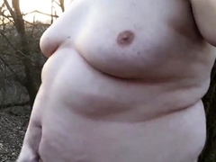 Chubby masturbates in the woods